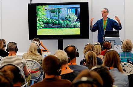 Man talking to crowd at Landscape Event 