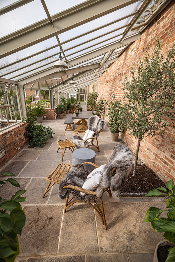 A Hartley Botanic greenhouse, bespoke lean-to in North Yorkshire with a relaxing space for entertaining