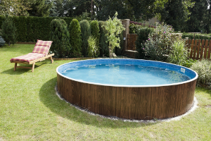 a circular swimming pool in a garden