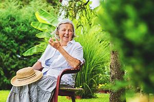 Woman Living With Dementia enjoying the Benefits of Gardening 