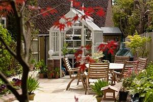 Greenhouse conservatory surrounded by flowers