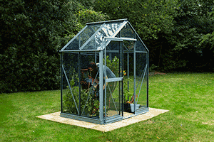 A woman Greenhouse Gardening