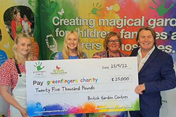 Abigail Stubbs, Amy Stubbs, Linda Petrons, David Domoney with the Greenfingers Cheque from British Garden Centres fund raining