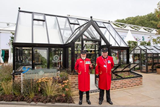 Chelsea Pensioners in front of Opus Grand Botanic Hartley Botanic Greenhouse press day