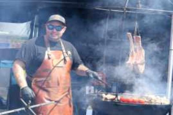 A man cooking on a bbq