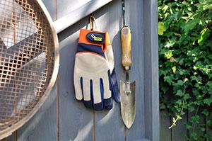 Treadstone Clever Clip Gloves hanging on a wall